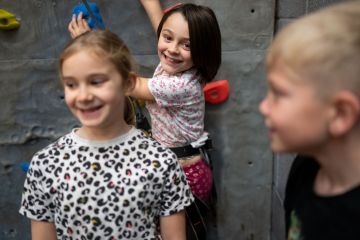 Young girl smiling in climbing